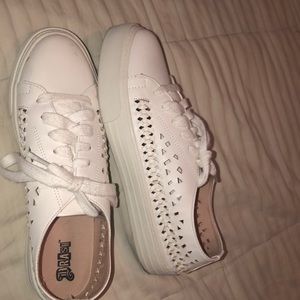 Sneakers with cut outs and braid detail on sides